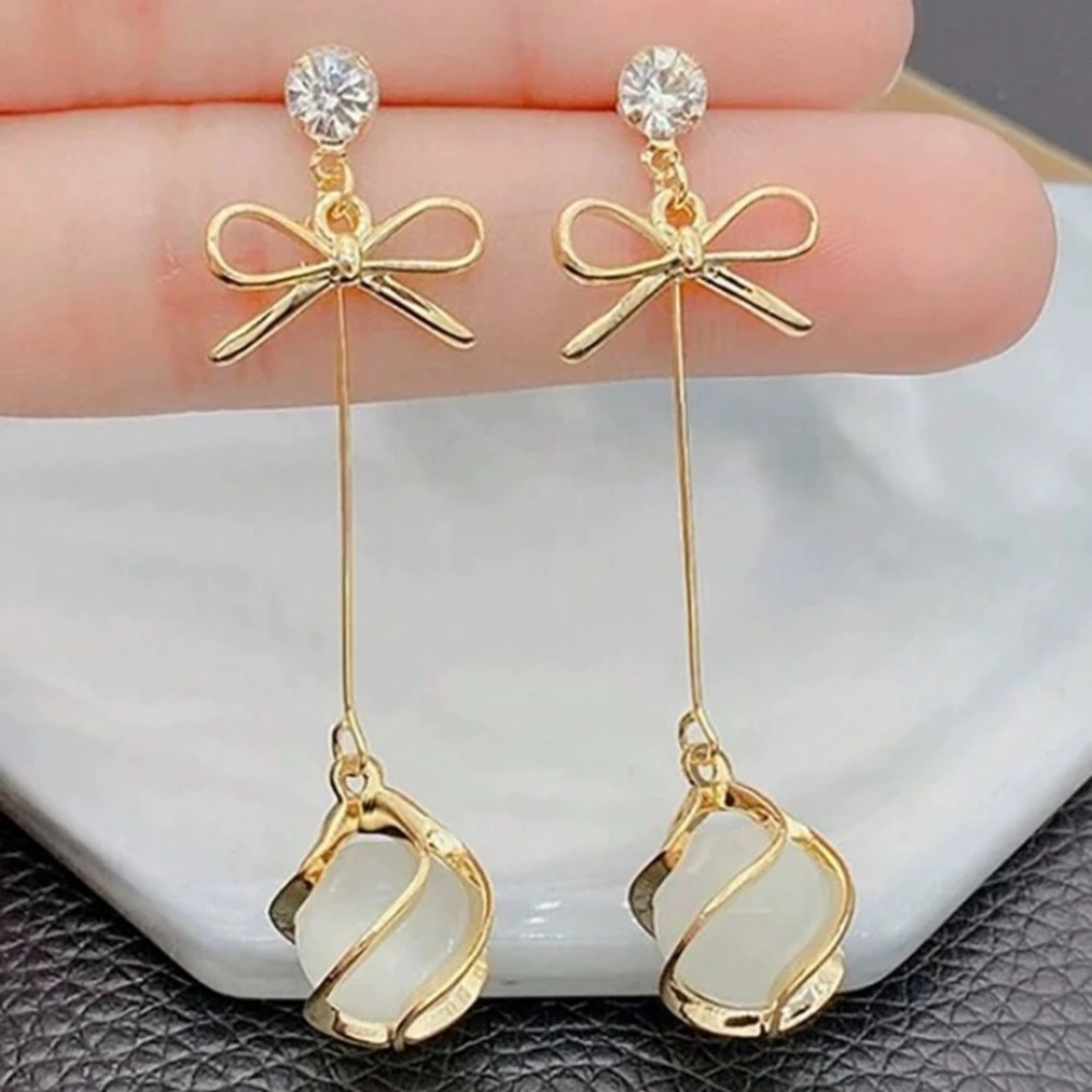 OVO Gold and White Bow Dangle Earrings